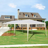 White outdoor canopy tent set up on a grassy lawn in front of a house.