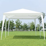White outdoor canopy tent set up on grass with trees in the background
