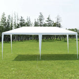 White outdoor canopy tent set up on a grassy area with trees in the background