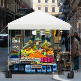 Street vendor stall with fresh produce and drinks in an urban setting