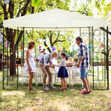 Family gathering under a canopy with balloons in a park