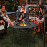 People gathered around a fire pit in an outdoor setting