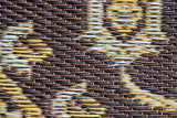 Close-up of woven material with brown, yellow, and gray pattern Turkish Black & Brown