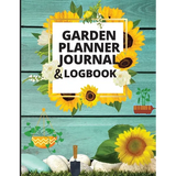 Garden planner journal with sunflowers and gardening tools on a wooden background
