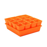 Orange seedling tray with multiple compartments on a white background 4 Cell Plug Tray Inserts