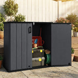 Black outdoor storage shed with tools and garden items on a patio