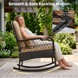 A woman sits in a dark wicker rocking chair with beige cushions on a patio, with text and an inset showing product features like front and rear anti-tip stoppers and anti-slip rubber strips.