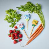 Fresh vegetables and fruits with 'Sweet Baby' labels on a light gray background Seed Pops - Garden