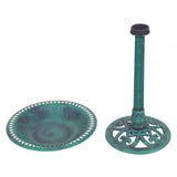 Teal bird bath with decorative stand on a white background