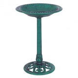 Green pedestal bird bath with decorative design on a white background