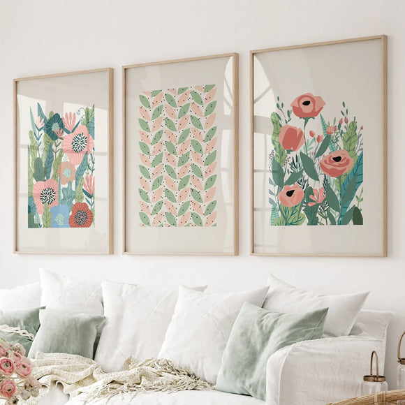 Botanical Pink Poppies Wall Art Poster Decor on a wall above a sofa.