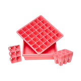 Set of pink plastic seedling trays on a white background