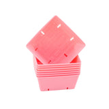 Stack of pink plastic containers on a white background 5x5 Deep Grow Tray Inserts