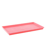 Pink plastic tray on a white background