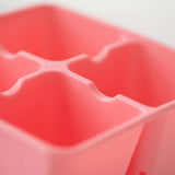 Close-up of a pink 4 Cell Plug Tray Insert