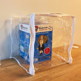 Mushroom growing kit packaging inside a clear plastic bag on a wooden surface.