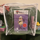 Mushroom growing kit labeled 'Fungi Friends' in a clear bag on a table.