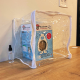 Packaged mushroom product with a clear plastic cover on a wooden surface.