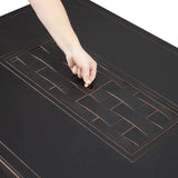 Hand pressing a button on a black surface with geometric patterns