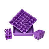 Purple plastic trays with small compartments on a white background