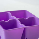 Close-up of a purple plastic 4 Cell Plug Tray Insert on a white background