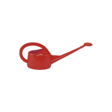 Red watering can on a white background