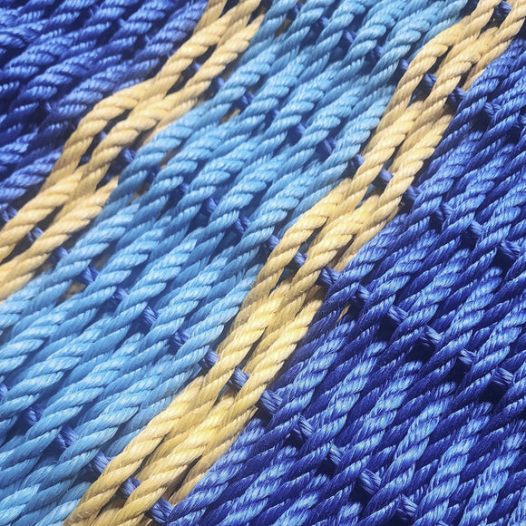 Close-up of blue and gold fabric texture