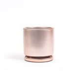 Rose gold planter on a white background