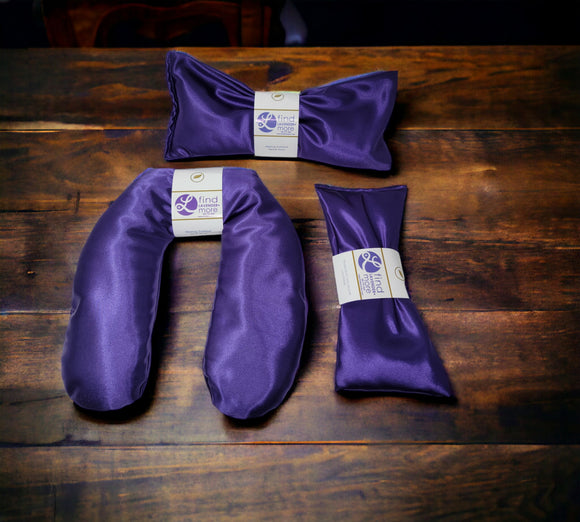 Ultimate Hot & Cold Herbal Neck Pillows - Natural Pain Relief on a wooden surface with visible brand labels.