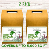 Two boxes of Flawn Seed Plus Speedy Bee Lawn Seed Kit on a wooden surface.