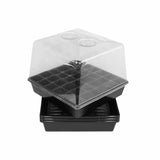 Stack of black plastic seed trays with transparent lids on a white background