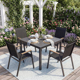 Outdoor dining set with table and chairs on a patio with flowers and a white pergola in the background.