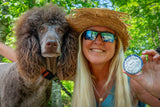 Woman with a dog outdoors, holding OLD FASHIONED MEN'S SHAVE SOAP