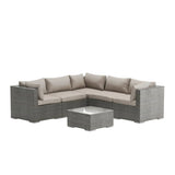 Outdoor furniture set with a sectional sofa and coffee table on a white background
