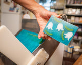 Hand holding a bar of LILY OF THE VALLEY SOAP SLICE 5.5 oz.