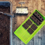 Seedling trays with soil blocks on a wooden surface Ladbrooke Soil Blockers - 2" Blocker (4 Blocks)
