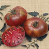 Three red tomatoes on a textured surface with leaf patterns TOMATO Seeds, Cherokee Purple