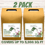Two packages of Tri-Color Clover Seed Kit with compost booster on a wooden surface.