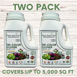 Two bottles of Flawn Seed Kits Tri-Color Clover Seed Kit on a wooden surface.