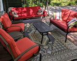 Red outdoor furniture set with cushions on a patio Turkish Black & Brown