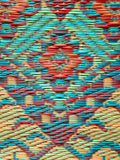 Colorful woven Turkish Plum fabric with a geometric pattern
