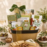 Gift basket with snacks and a glass of wine on a table.
