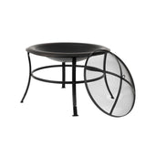 Black metal fire pit table with a mesh screen on a white background