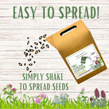 Seed packet with seeds spilling out on a wooden background, promoting easy seed spreading.