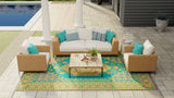 Outdoor patio furniture set with a Turkish Aqua rug on a patio area near a pool.