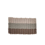 Woven rectangular mat with gradient color pattern on a white background