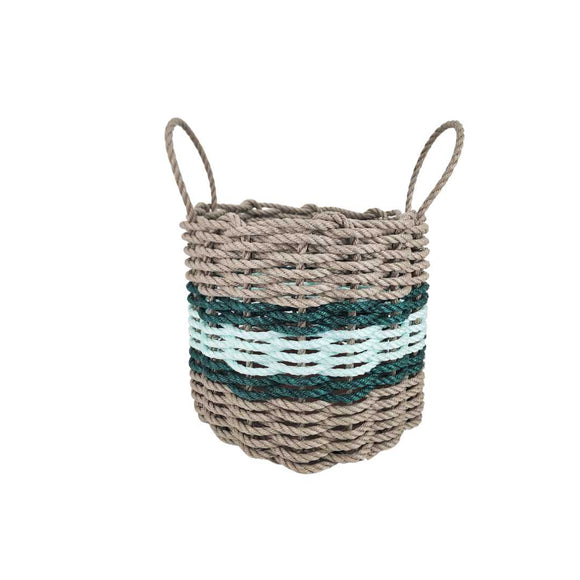 Woven basket with handles in beige, green, and white stripes on a white background