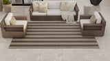 Outdoor furniture set with a Vertical Stripe Beige striped rug on a tiled patio