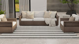 Outdoor patio furniture set with cushions on a patio area.