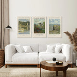 Living room with a white sofa, round wooden coffee table, and Monet Set of 3 Printable Exhibition Posters on the wall.